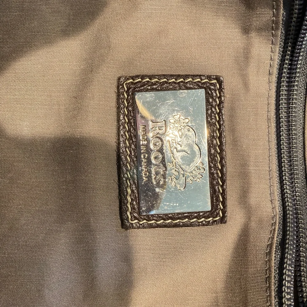 Roots Brown Leather hand Bag or crossbody bag